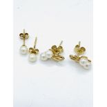 Two pairs of gold and pearl earrings.