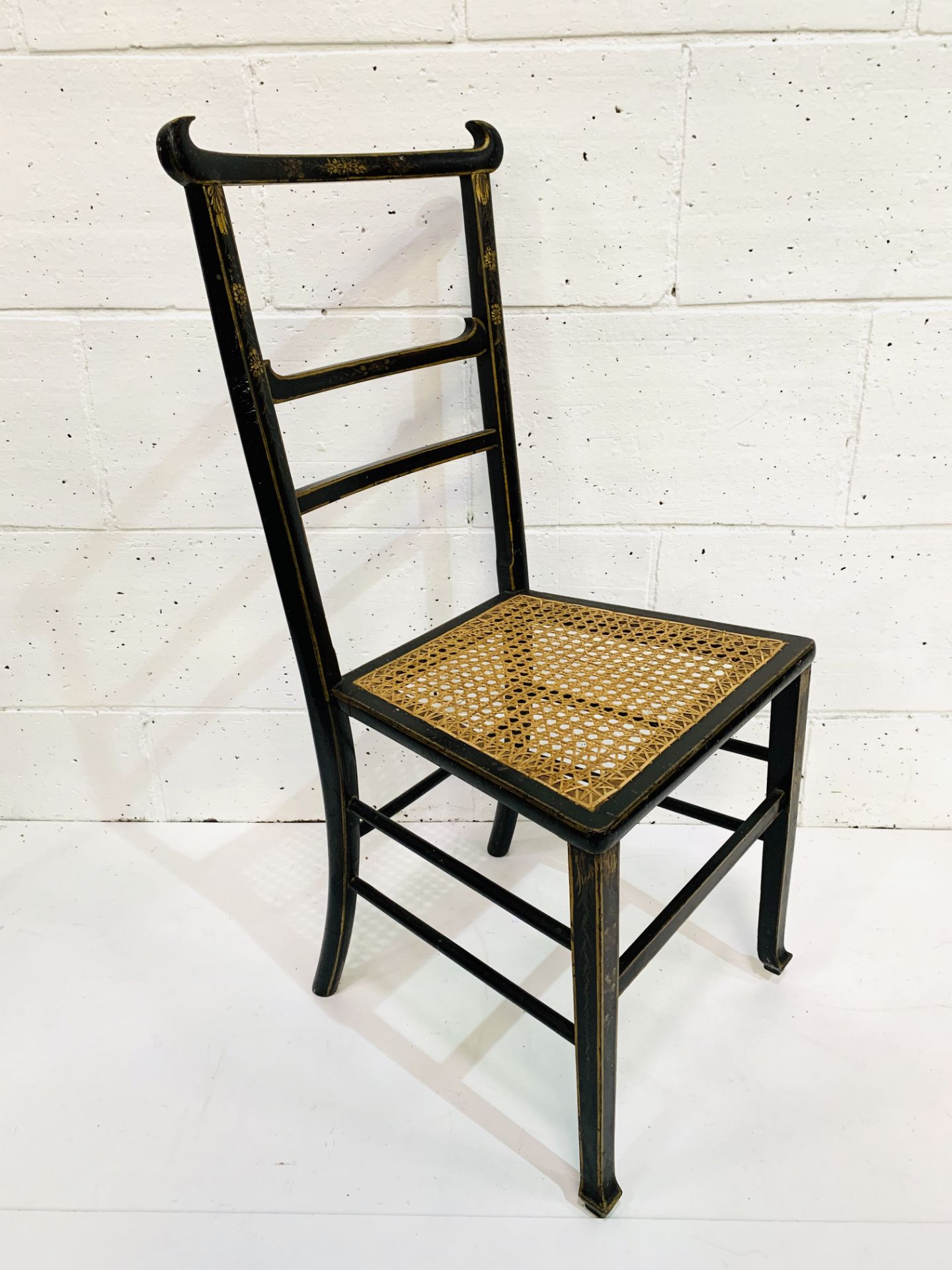 Ebonised and gilt decorated cane seat ladder back chair. - Image 5 of 5