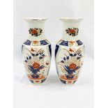 Pair of contemporary Japanese Imari baluster vases with gilt finish in blue & iron red.