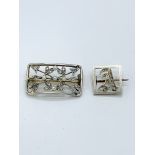 Two diamond set brooches
