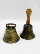 Two antique brass bells, one with hoop handle and the other with a school handle.