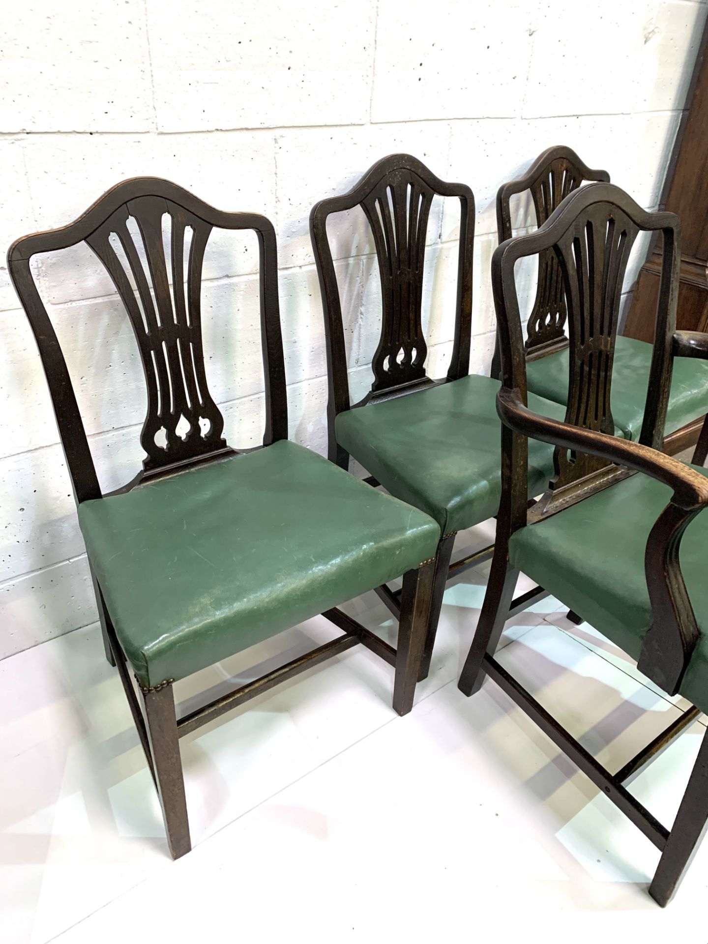 Set of four Victorian dining chairs, three plus one, upholstered in green leather. - Image 3 of 5