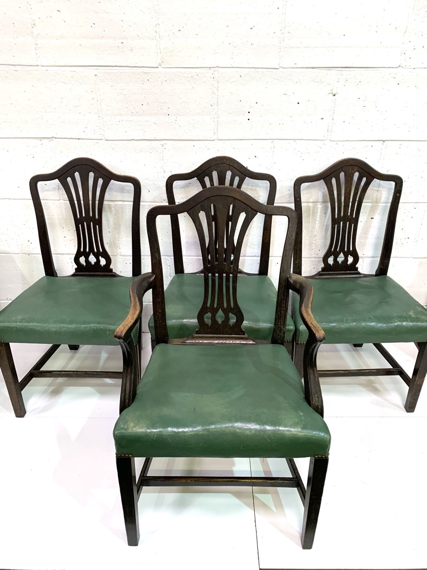 Set of four Victorian dining chairs, three plus one, upholstered in green leather. - Image 5 of 5