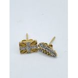 2 men's single 9ct gold diamond set earrings.