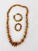 3 items of amber coloured jewellery