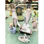 Four Lladro figurines and two Nao figurines.