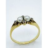 18ct diamond and seed pearl ring.