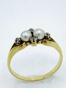 18ct diamond and seed pearl ring.