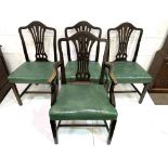 Set of four Victorian dining chairs, three plus one, upholstered in green leather.