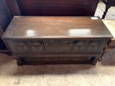 Oak chest with carved panel front.