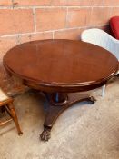 Mahogany circular tilt top dining table.