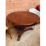 Mahogany circular tilt top dining table.