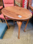 Hardwood oval top side table and an ottoman