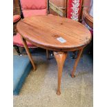 Hardwood oval top side table and an ottoman