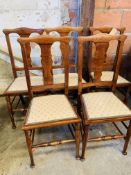 Five oak dining chairs.