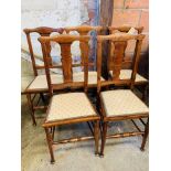 Five oak dining chairs.