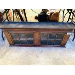 Mahogany wall mounted display cabinet with two shelves and two glazed doors.