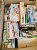 Box of Airfix and other plastic model kits.