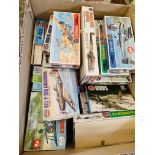 Box of Airfix and other plastic model kits.