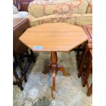 Octagonal tilt-top wine table on pedestal to three feet.