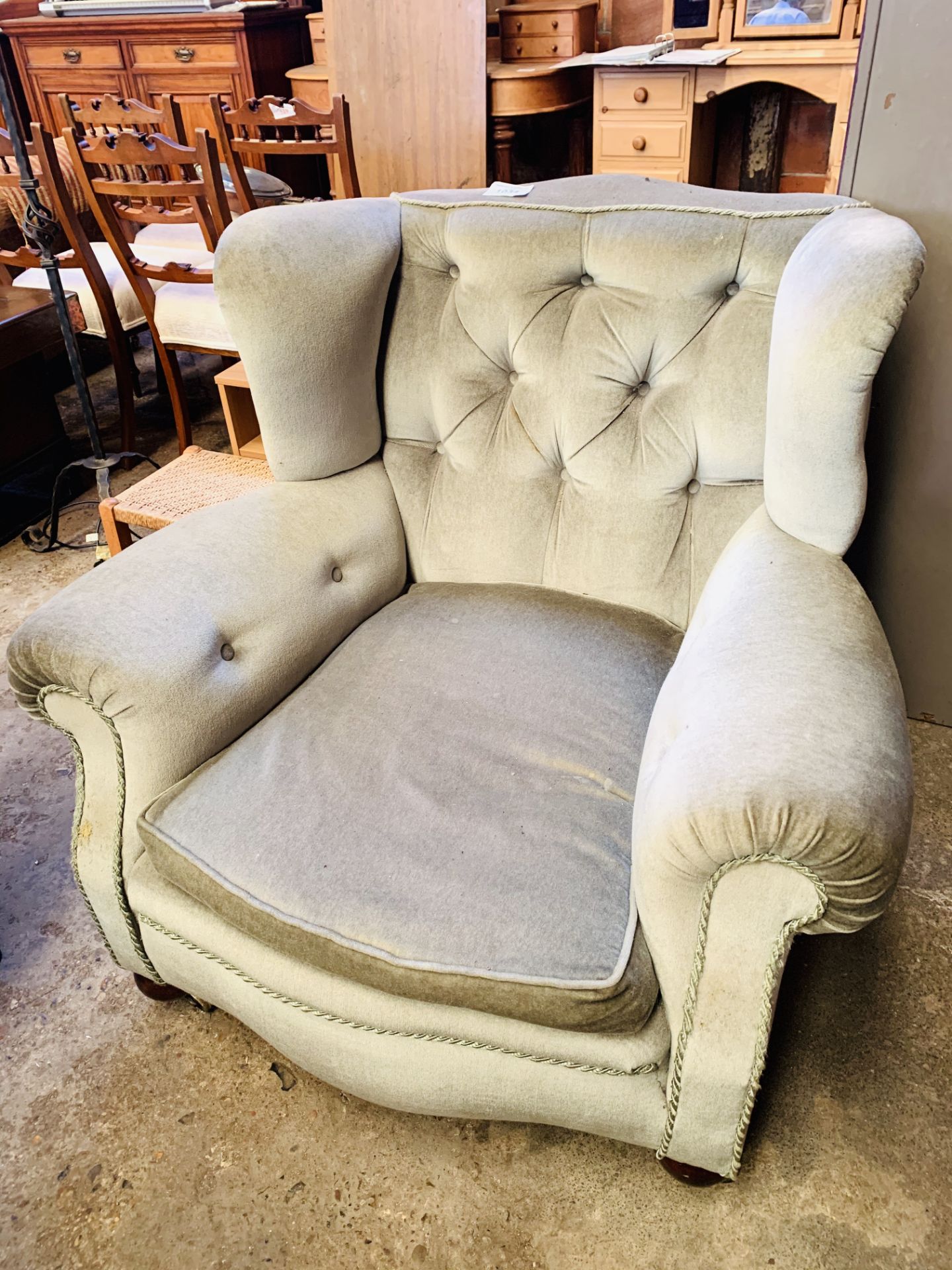 A large green upholstered Victorian armchair on casters. - Image 2 of 2