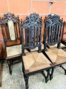 Five oak framed hall chairs with carved top and centre splat.