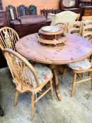 Circular drop-leaf pine kitchen table; 4 Windsor chairs; utensil hanger and pine cased clock