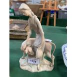 Large Nao figurine of a girl feeding a calf