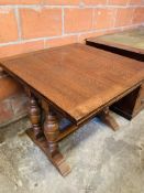 Oak draw leaf extending dining table.