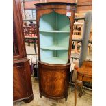 Mahogany bow-fronted corner cabinet.