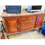 Mahogany curved front sideboard with 3 centre drawers, flanked by cupboards.