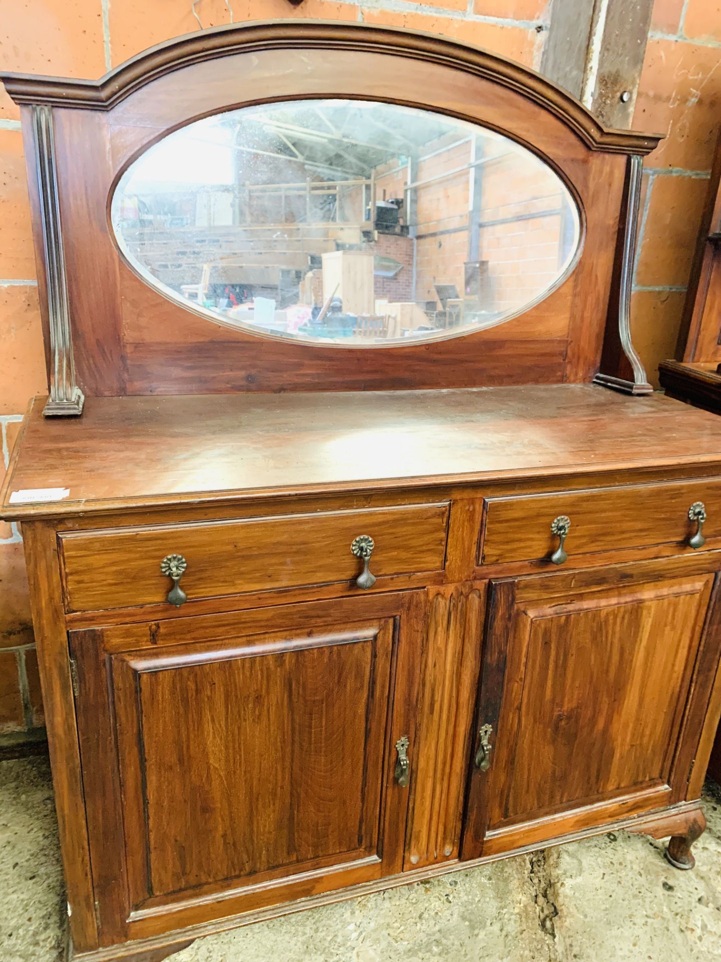 Mahogany mirrored sideboard with two frieze drawer over two cupboards.