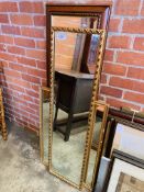 Three framed wall mirrors