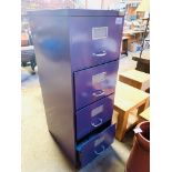 Four drawer purple coloured metal filing cabinet.