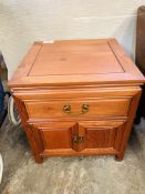 Hardwood bedside table, with frieze drawer over cupboard.