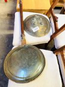 Brass bowl-shaped ornament together with a brass and copper long handled bed warming pan.