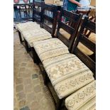 6 oak ladder backed upholstered dining chairs.