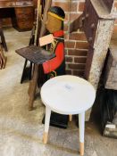 Wooden circular stool and a wooden 'serving' figure.