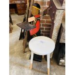 Wooden circular stool and a wooden 'serving' figure.