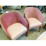 Pair of Lloyd Loom chairs with upholstered seats.