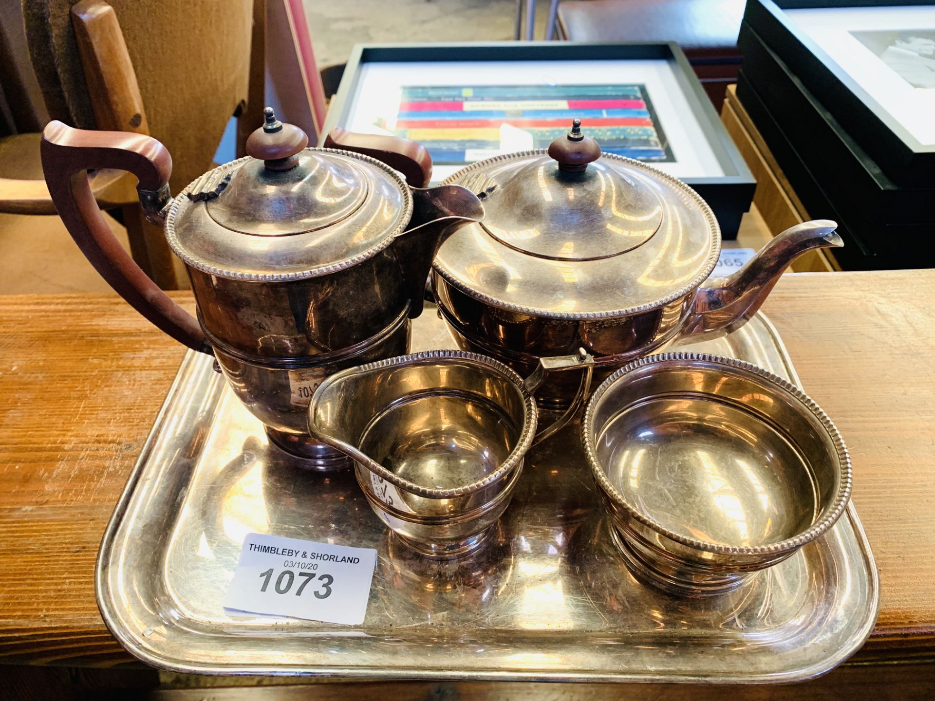 Silver plated tea set on tray.