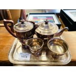 Silver plated tea set on tray.