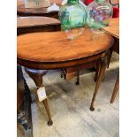 Mahogany kidney shaped occasional table.