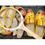 5 pairs of wooden clogs, and a wooden tennis racquet.