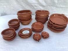 30 pieces of assorted terracotta cook/tableware, some branded