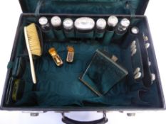 A Victorian brown leather vanity case with green fabric interior and contents