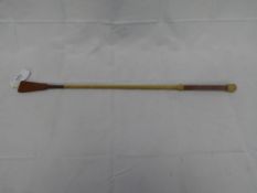 Leather handled cane whip