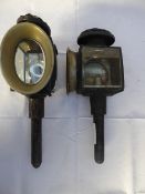 A pair of black/brass carriage lamps, one with cracked lens; pair of wagon side lamps; pair of spurs