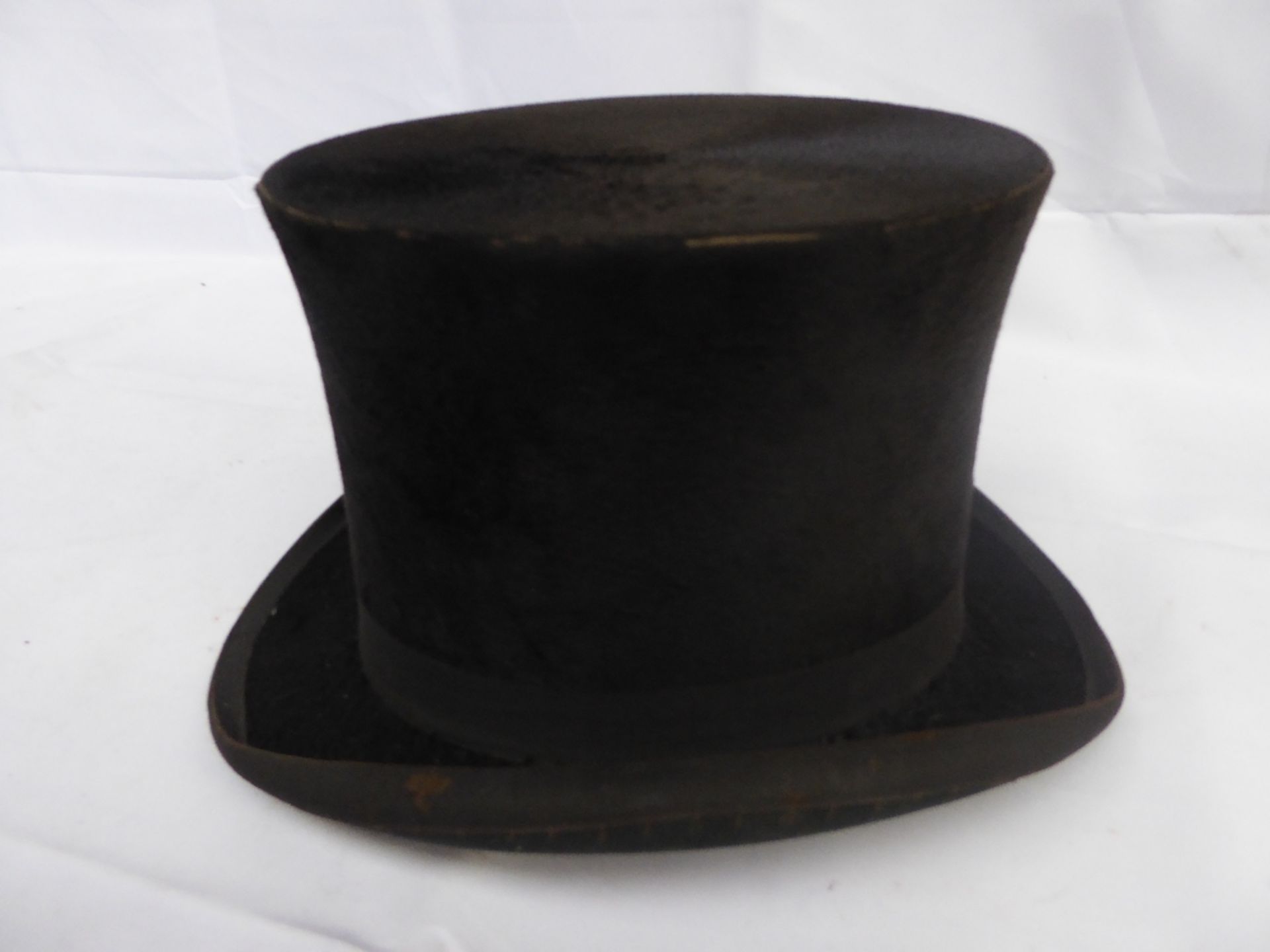 Small black top hat by Christy's of London