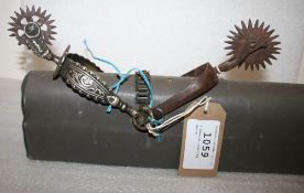 2 unusual rowelled spurs